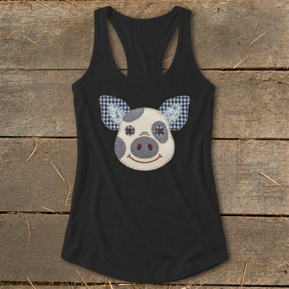 Black tank top with a stitched pig face applique and gingham ears.