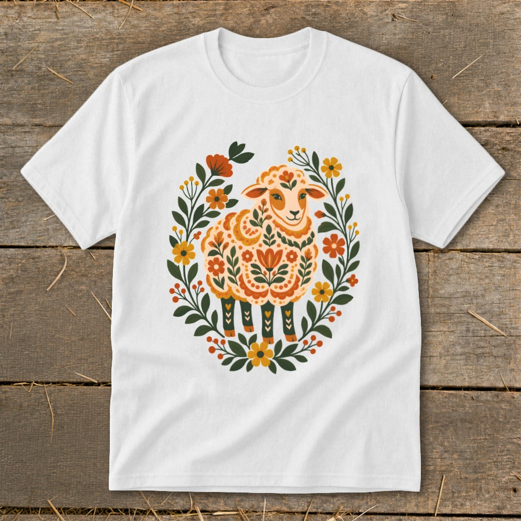White t-shirt with a folk art sheep surrounded by a floral wreath.