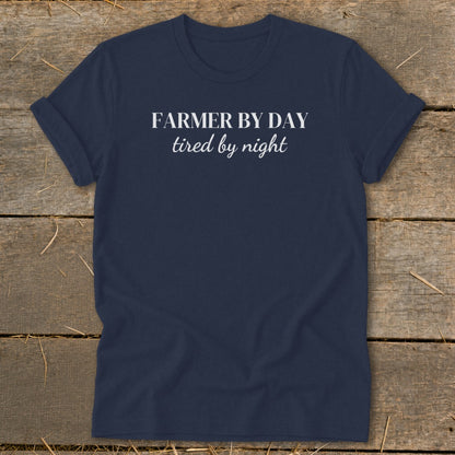 Navy t-shirt with white text reading "FARMER BY DAY tired by night".