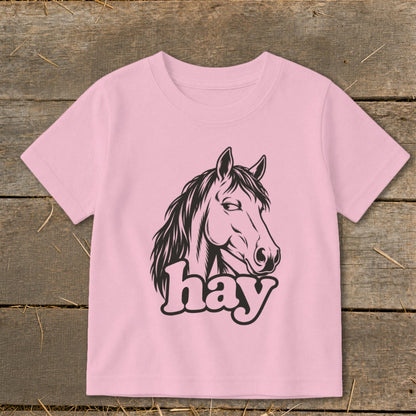 Pink t-shirt with black illustration of a horse head and the word "hay".