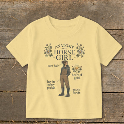 Yellow t-shirt with "Anatomy of a Horse Girl" graphic, featuring text and illustrations.