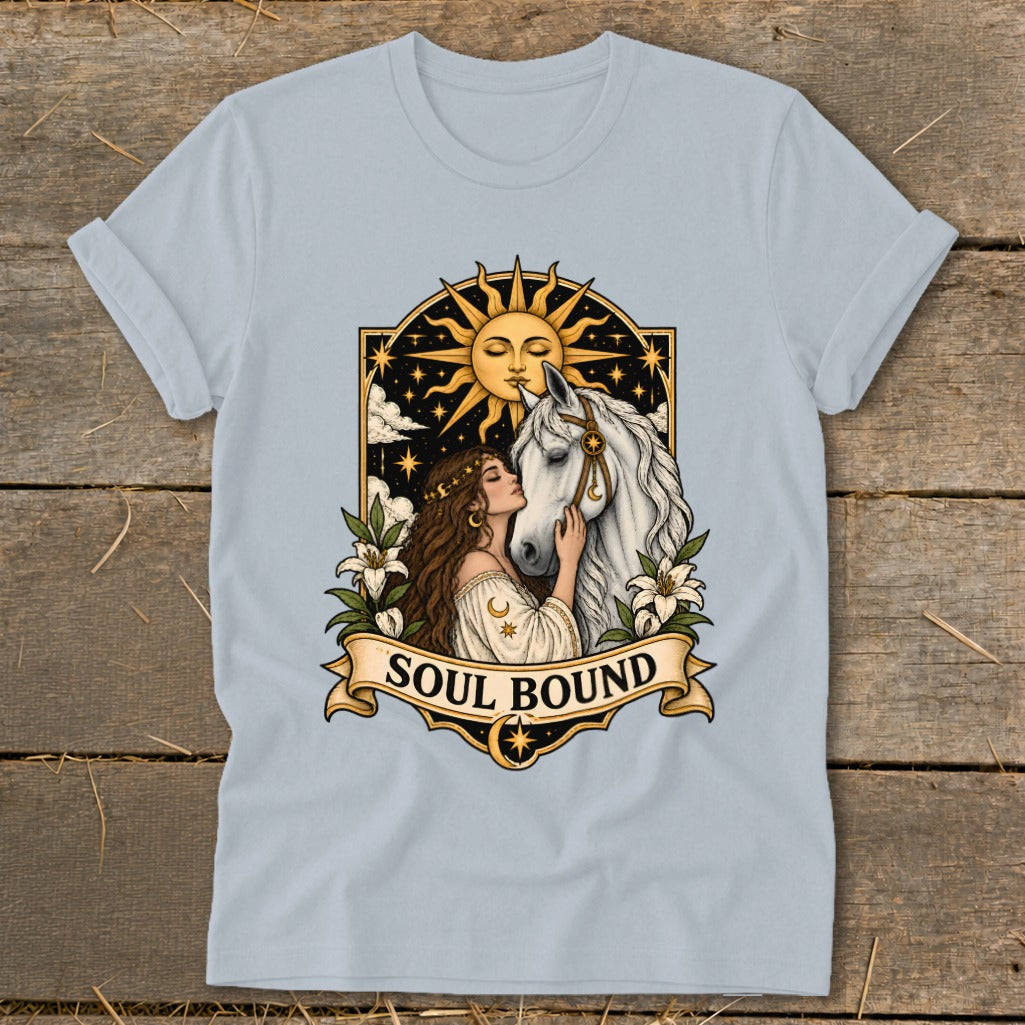 Woman kissing white horse with sun, stars, and "Soul Bound" text on light blue t-shirt.