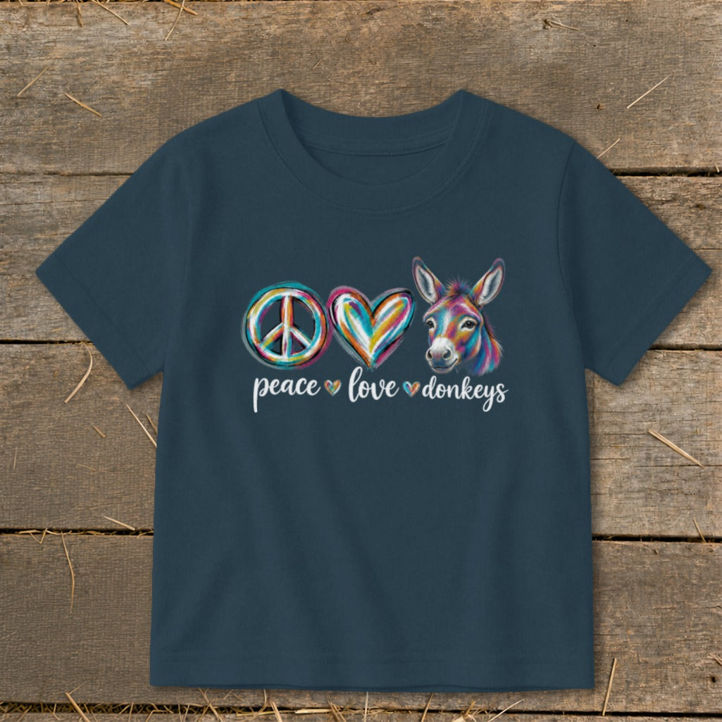 Dark blue t-shirt with peace sign, heart, and colorful donkey, text "peace love donkeys".