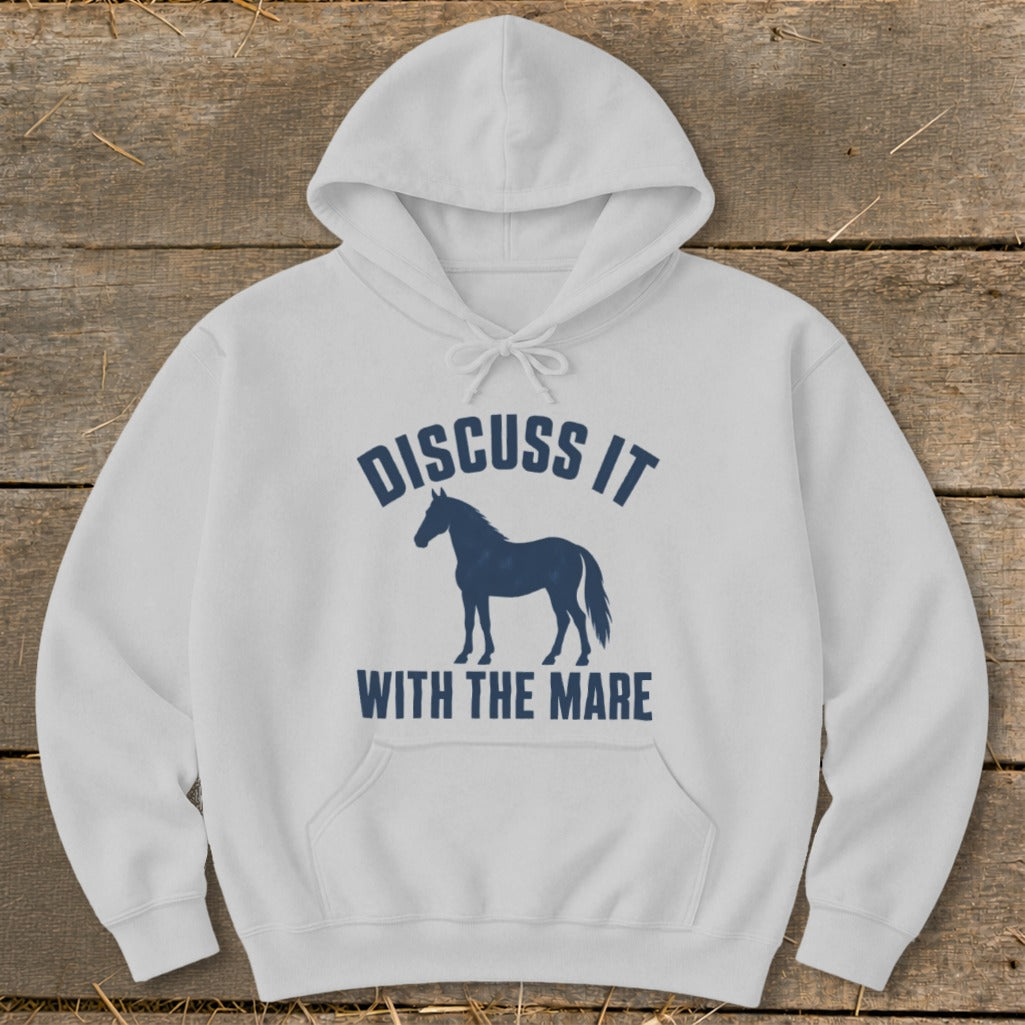 White hoodie with dark blue text "Discuss It With The Mare" and a horse silhouette.