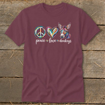 Maroon t-shirt with peace sign, heart, and colorful donkey graphic.