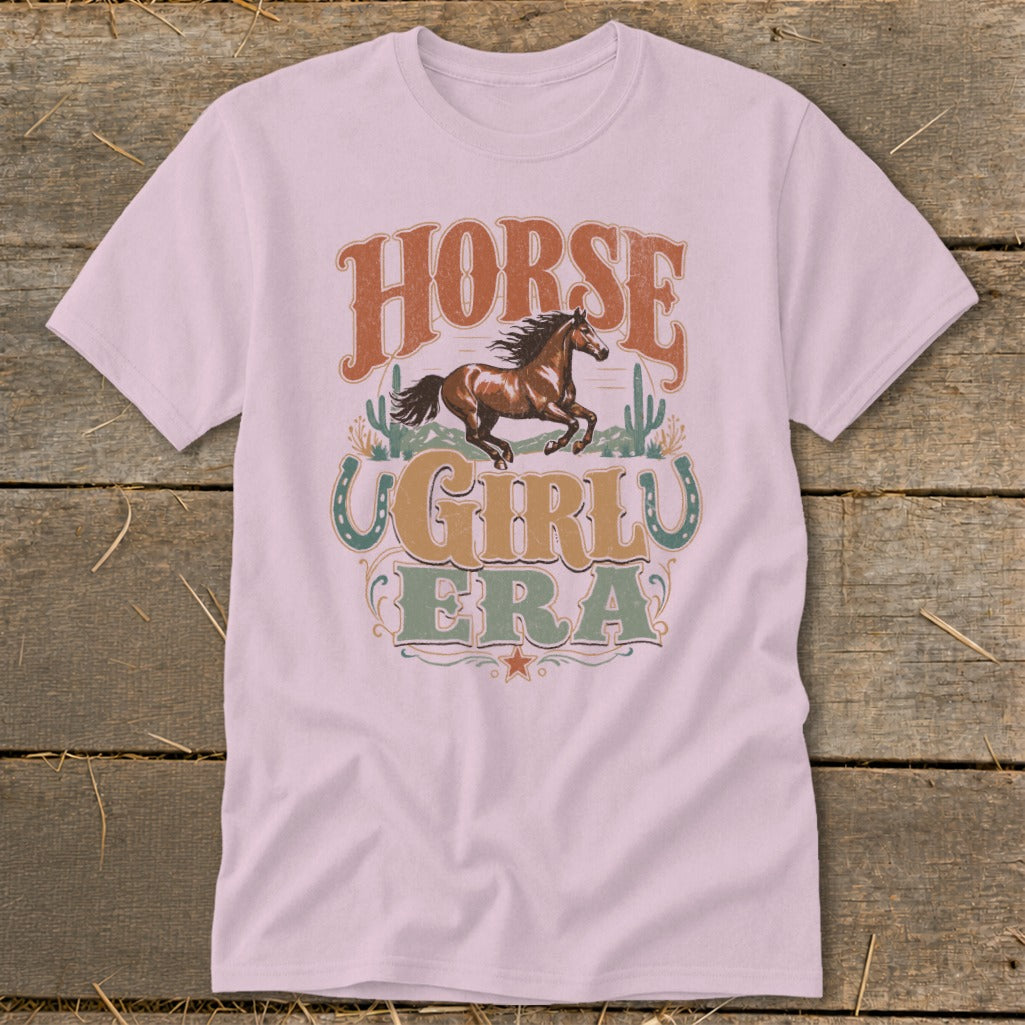 Pink t-shirt with "HORSE GIRL ERA" text and a running horse graphic.