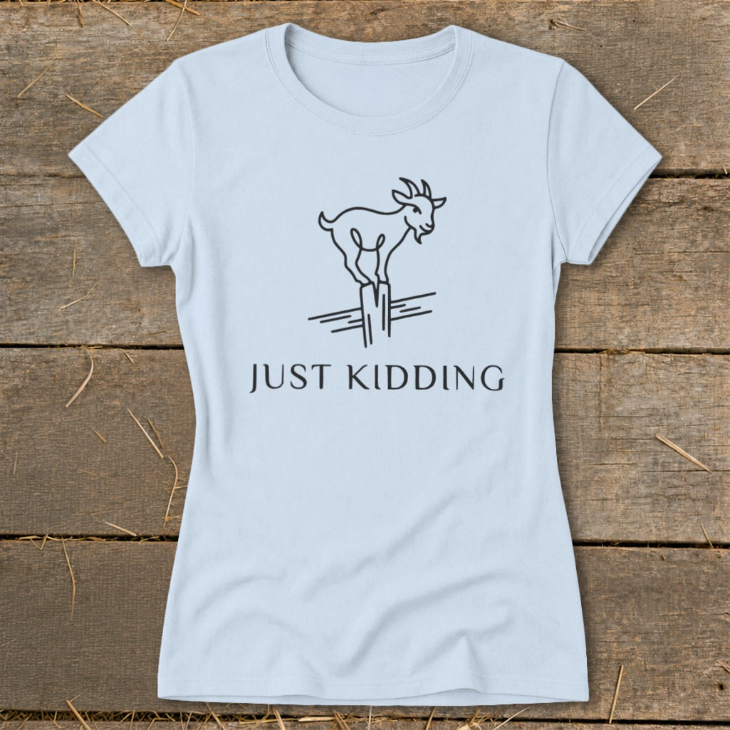 Light blue t-shirt with line drawing of a goat on a post and "JUST KIDDING" text.