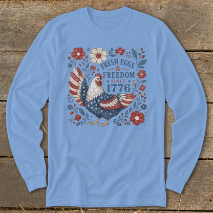 Light blue long sleeve shirt with chicken, flowers, and text "Fresh Eggs & Freedom Since 1776".
