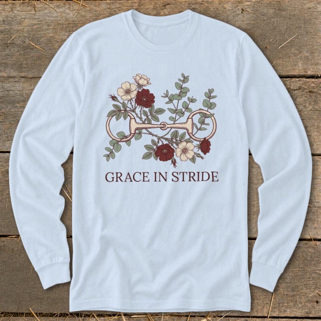 Light blue long sleeve shirt with floral horse bit graphic and "GRACE IN STRIDE" text.