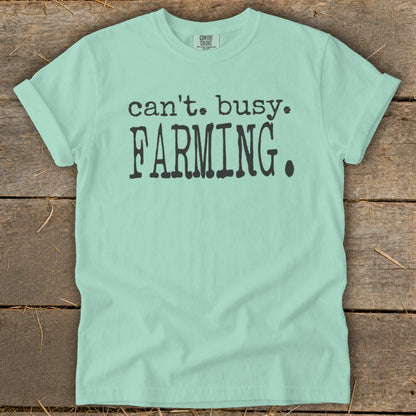Light green t-shirt with black text that reads "can't. busy. FARMING."