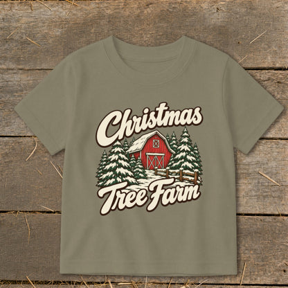 T-shirt with "Christmas Tree Farm" text and illustration of a red barn surrounded by pine trees.