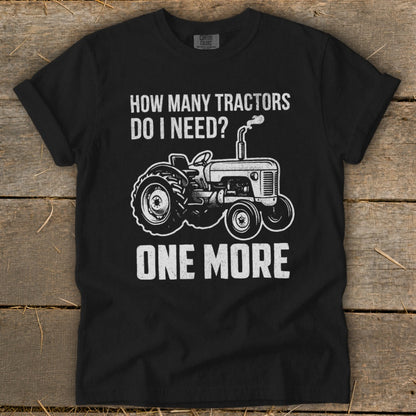 Black t-shirt with "How Many Tractors Do I Need? One More" and tractor graphic.
