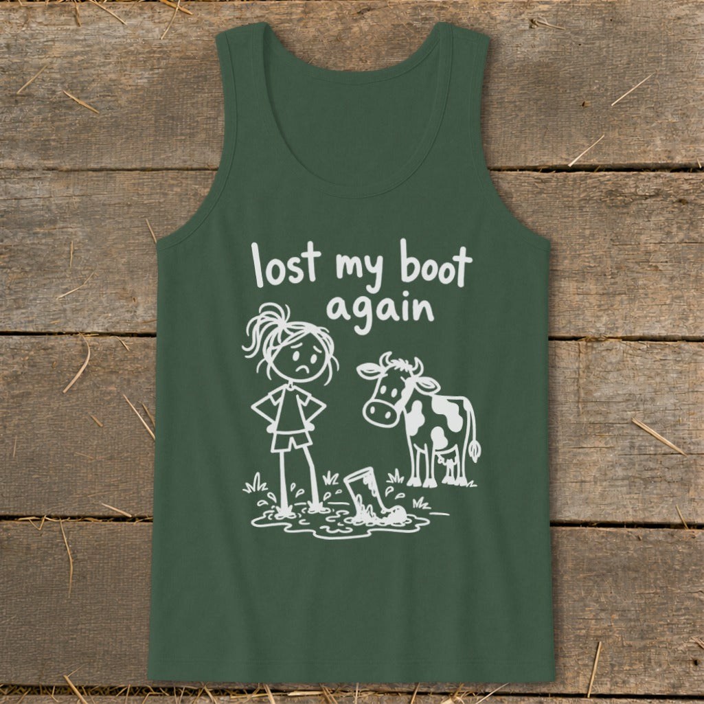 A dark green tank top featuring a white graphic of a person and cow looking at a lost boot in a puddle, with the text "lost my boot again."