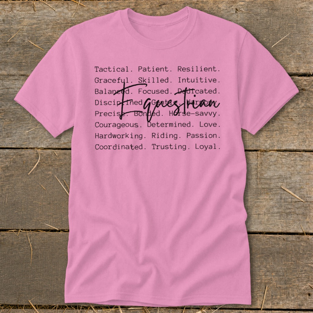 Pink t-shirt with list of traits describing a "girl boss equestrian" or "horse woman."