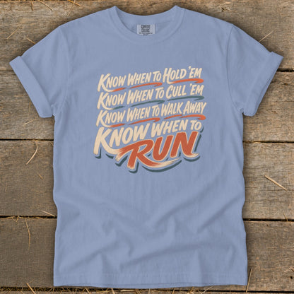 Light blue t-shirt with "Know When To Hold 'Em, Cull 'Em, Walk Away, Run" text.