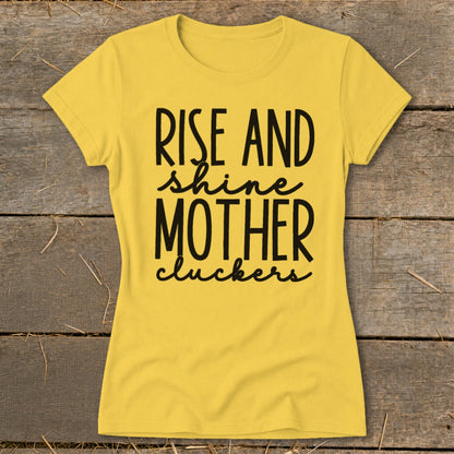 Yellow t-shirt with black text "Rise and shine Mother cluckers".