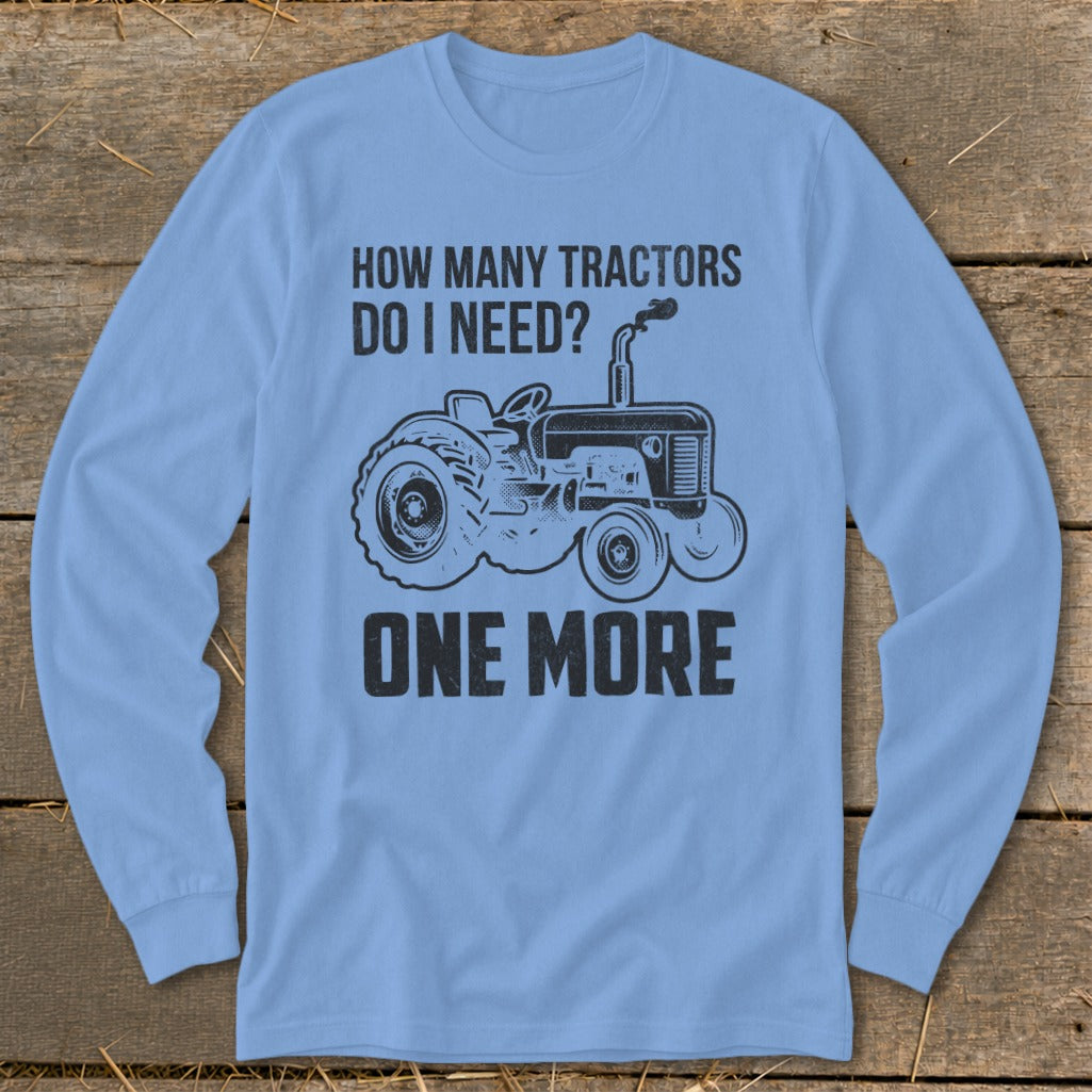 Light blue long sleeve shirt with a black graphic of a tractor and text.