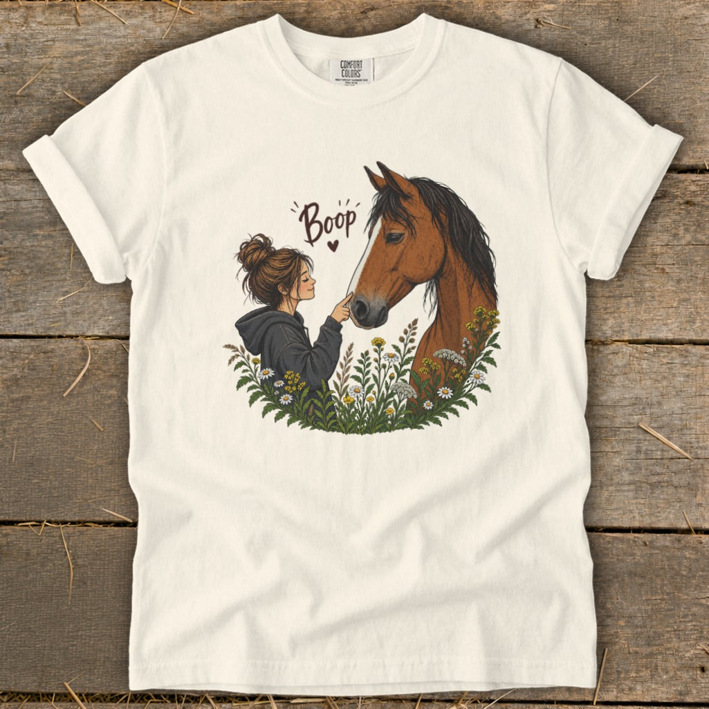 Illustration of a girl touching a horse's nose, with the word "Boop" above.