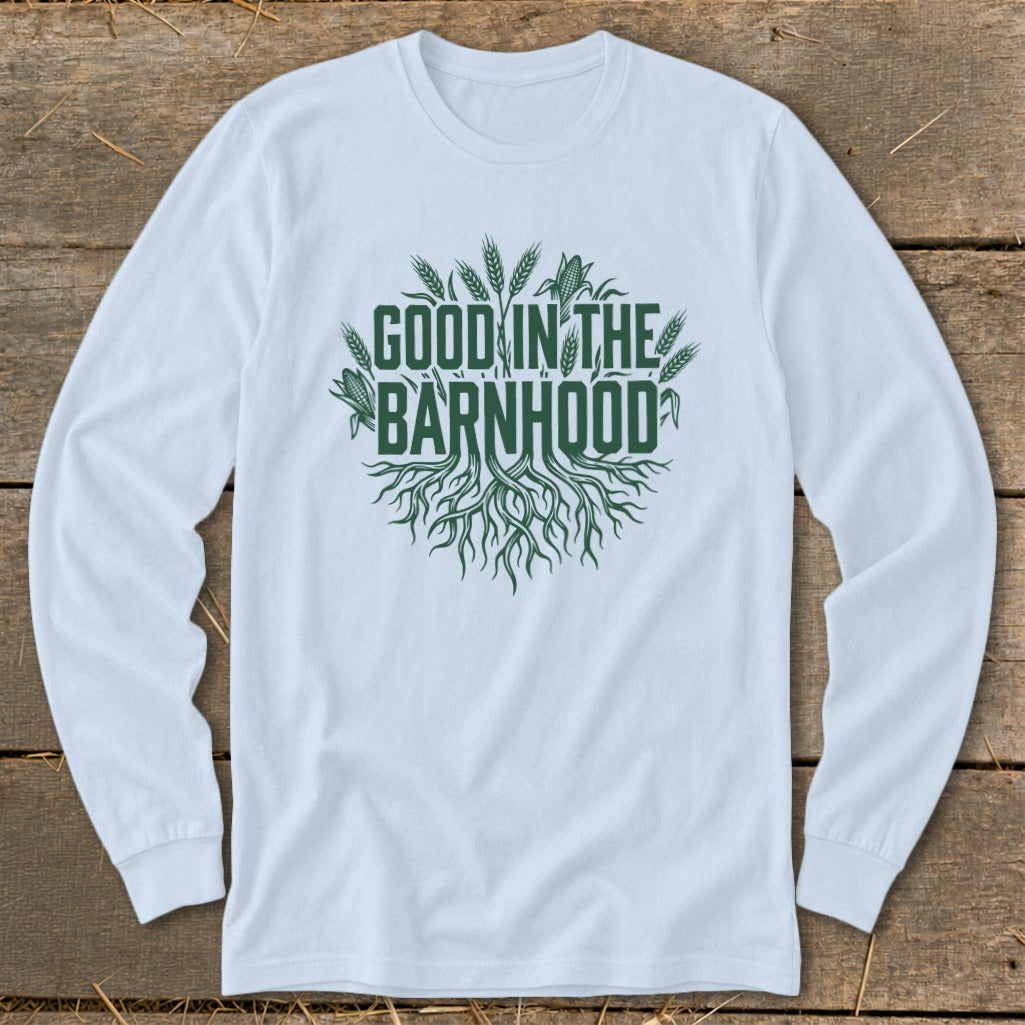 White long-sleeved shirt with green text and roots graphic reading "GOOD IN THE BARNHOOD".