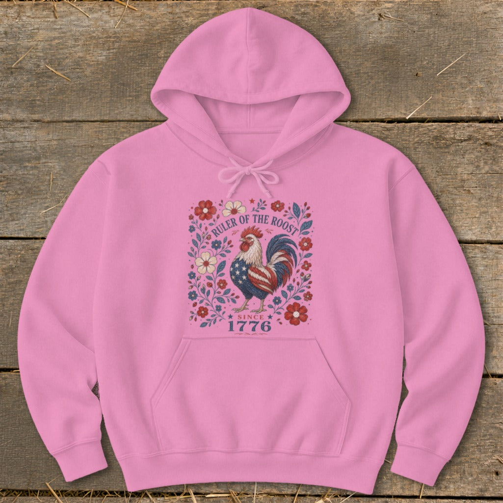 Pink hoodie with patriotic rooster graphic and text "RULER OF THE ROOST SINCE 1776".