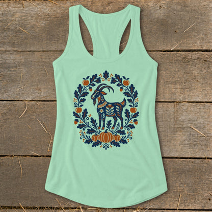 Light green racerback tank top featuring a folk art goat surrounded by autumn foliage and pumpkins.