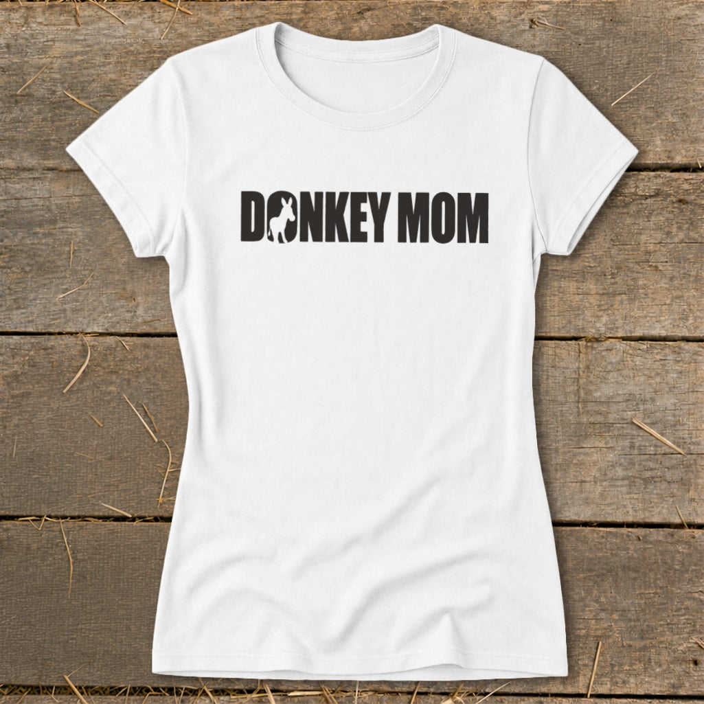 A white women's short-sleeve t-shirt with black text reading "DONKEY MOM" featuring a donkey silhouette inside the letter O.