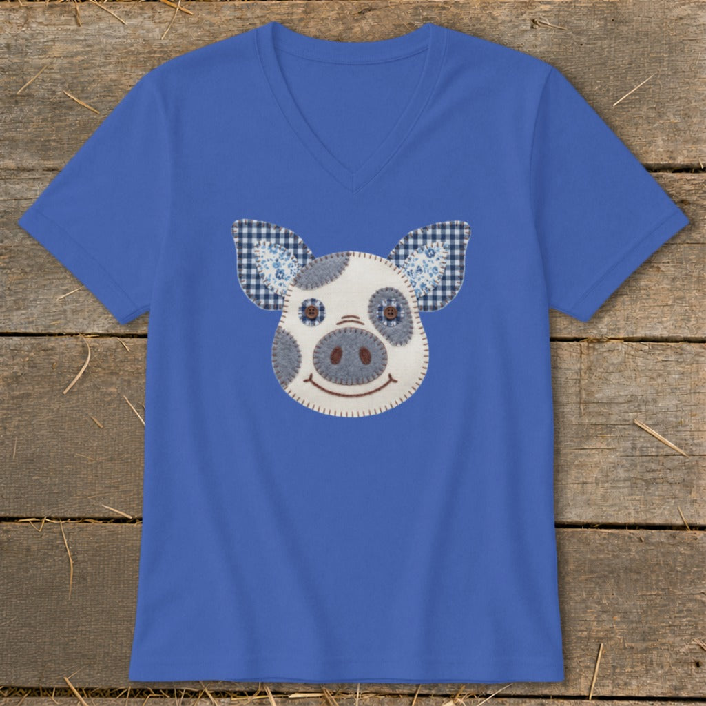 Blue v-neck t-shirt with a fabric patch pig face design.