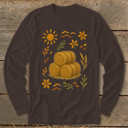 Brown long-sleeve shirt with hay bales and autumnal floral graphic.