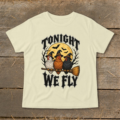 Three witch-hatted chickens fly on a broomstick with the text "Tonight We Fly."