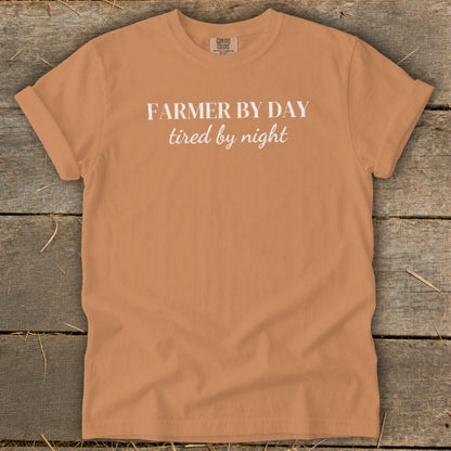 Orange t-shirt with white text "FARMER BY DAY tired by night"