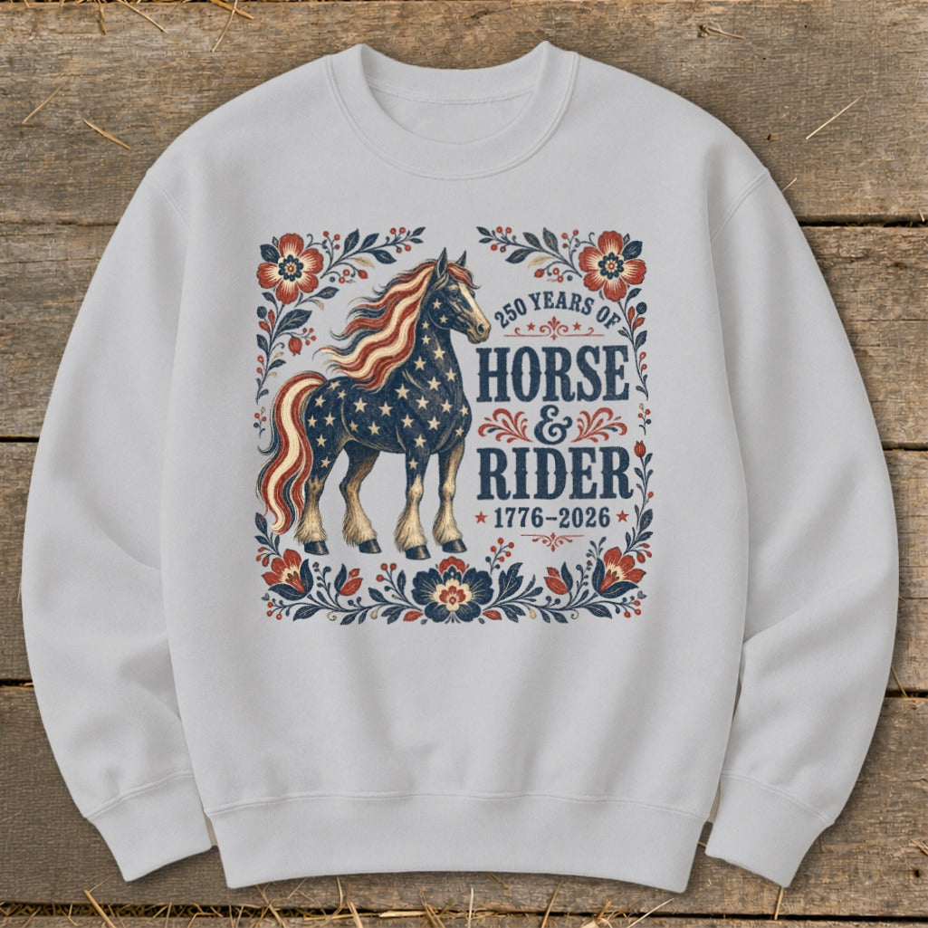 White sweatshirt with patriotic horse and "250 Years of Horse & Rider 1776-2026" text.
