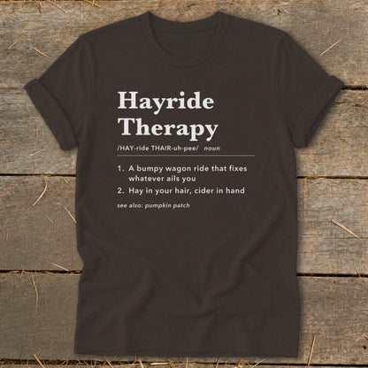 Dark t-shirt with "Hayride Therapy" definition: bumpy wagon ride fixes woes.