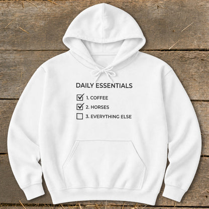 White hoodie with "Daily Essentials" checklist: Coffee, Horses, Everything Else.
