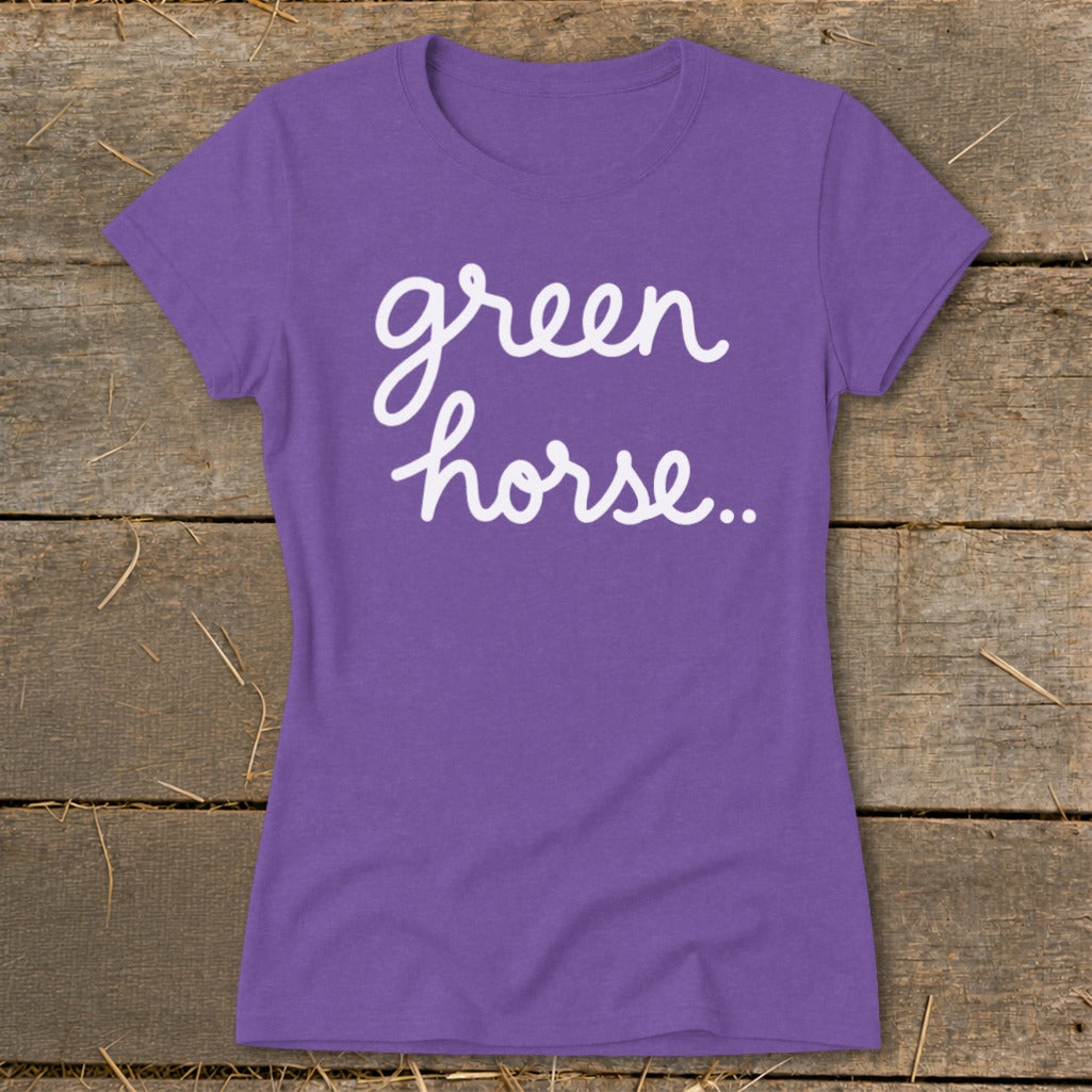 Purple t-shirt with white cursive text that reads "green horse..".