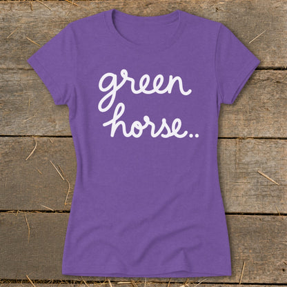Purple t-shirt with white cursive text that reads "green horse..".