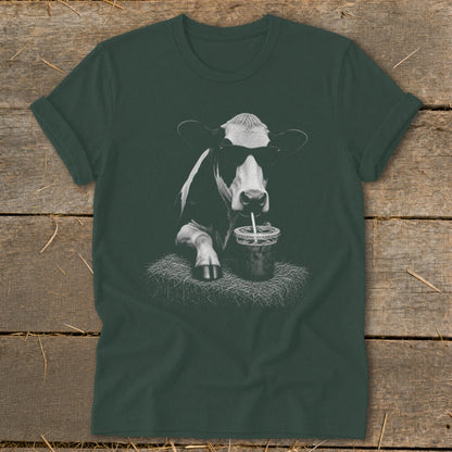 Black and white cow wearing sunglasses, drinking from a straw.