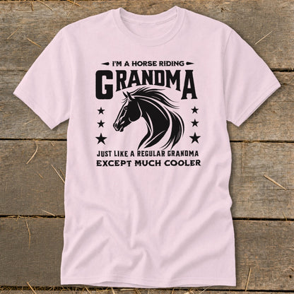 Pink t-shirt with black text and horse graphic saying "I'm a horse riding Grandma".