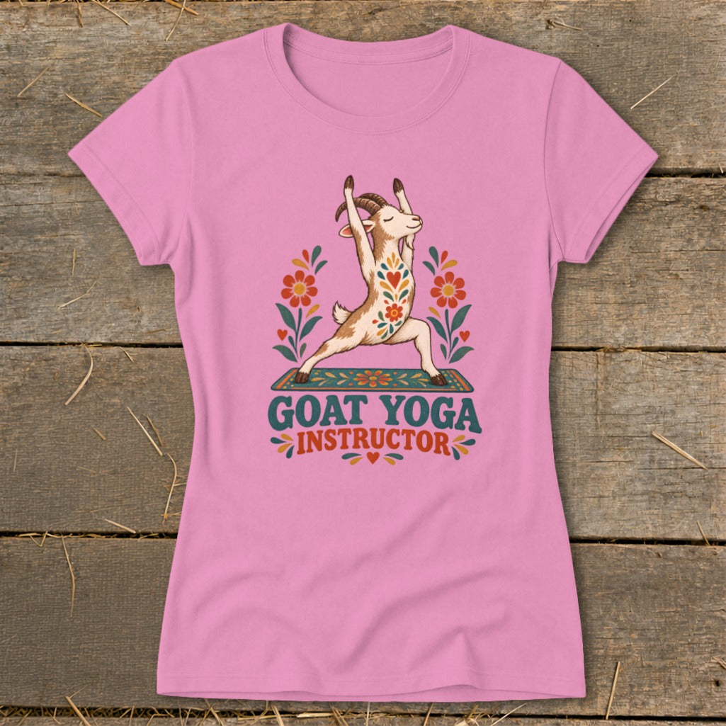 Pink t-shirt with illustration of goat doing yoga and text "GOAT YOGA INSTRUCTOR".