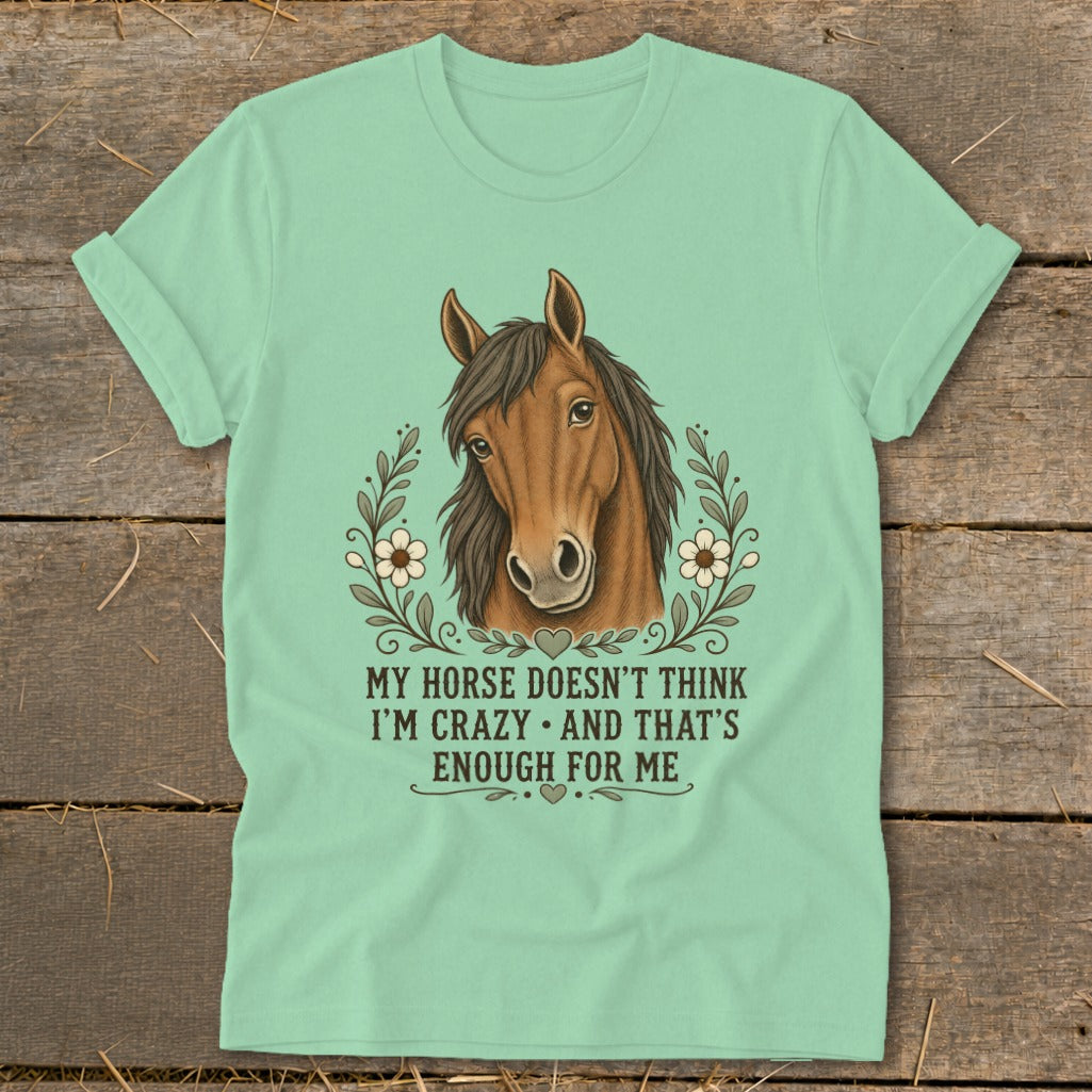 Mint t-shirt with horse illustration and text: "MY HORSE DOESN'T THINK I'M CRAZY. AND THAT'S ENOUGH FOR ME."