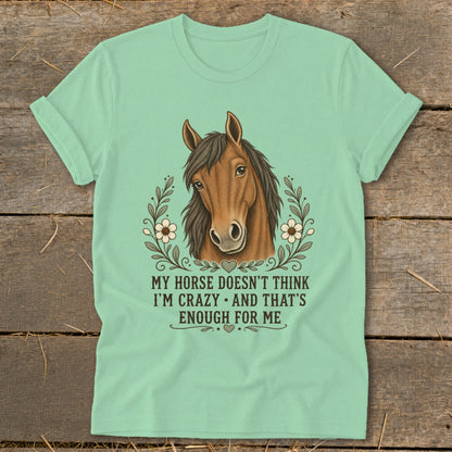 Mint t-shirt with horse illustration and text: "MY HORSE DOESN'T THINK I'M CRAZY. AND THAT'S ENOUGH FOR ME."