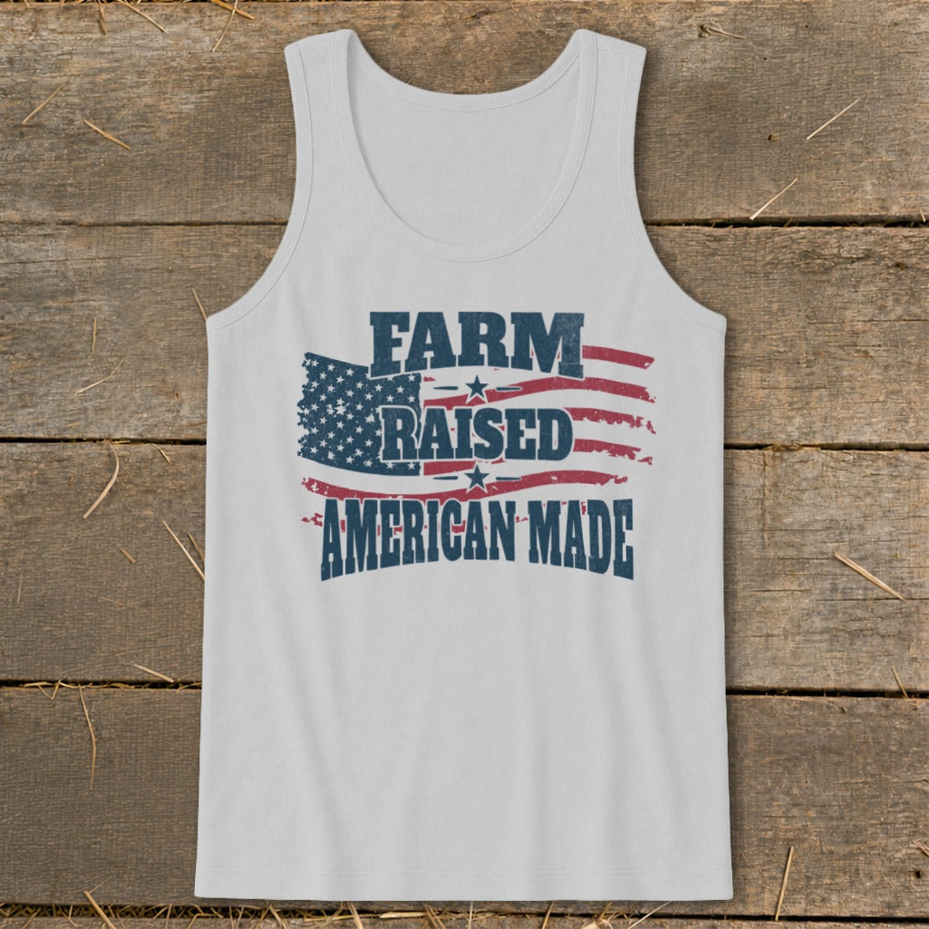 White tank top with distressed American flag and text "FARM RAISED AMERICAN MADE".