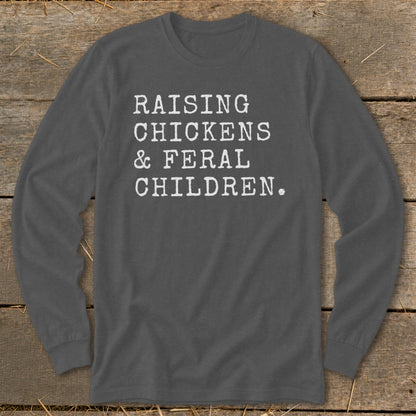 Long sleeve charcoal shirt with white text: "RAISING CHICKENS & FERAL CHILDREN."