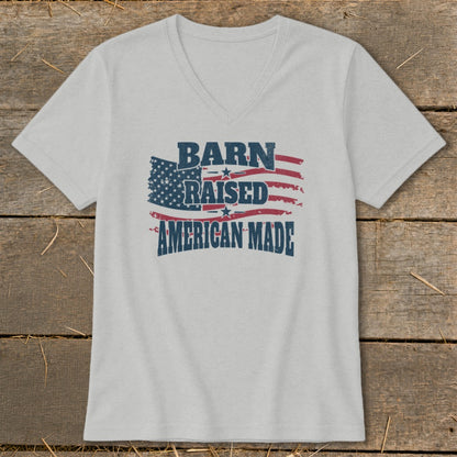 Light gray v-neck t-shirt with distressed American flag and text "BARN RAISED AMERICAN MADE".