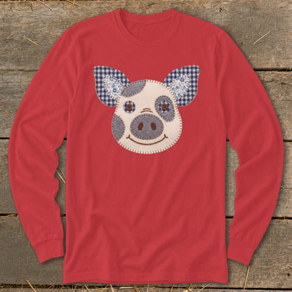 Red long sleeve shirt with a felt pig face applique and checkered ears.