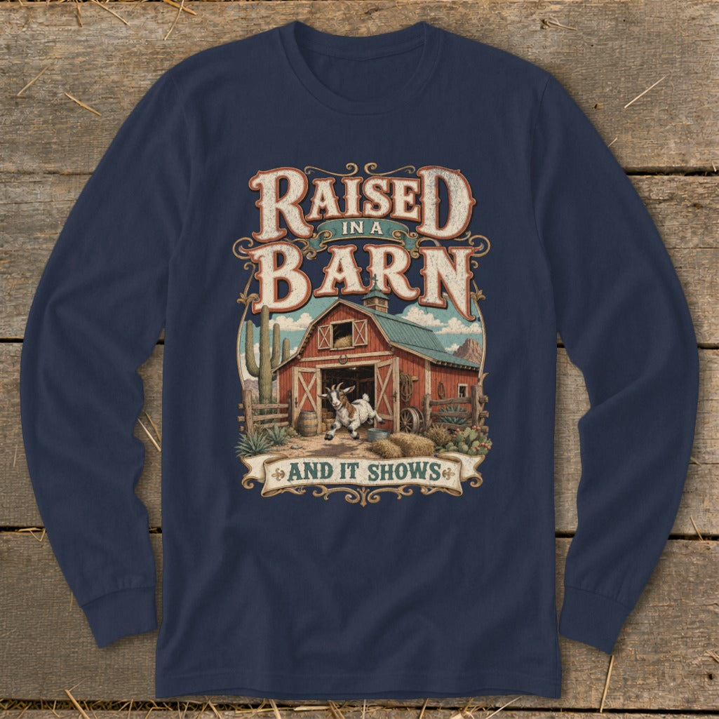 Navy long sleeve shirt with "Raised in a Barn And It Shows" text and barn scene graphic.