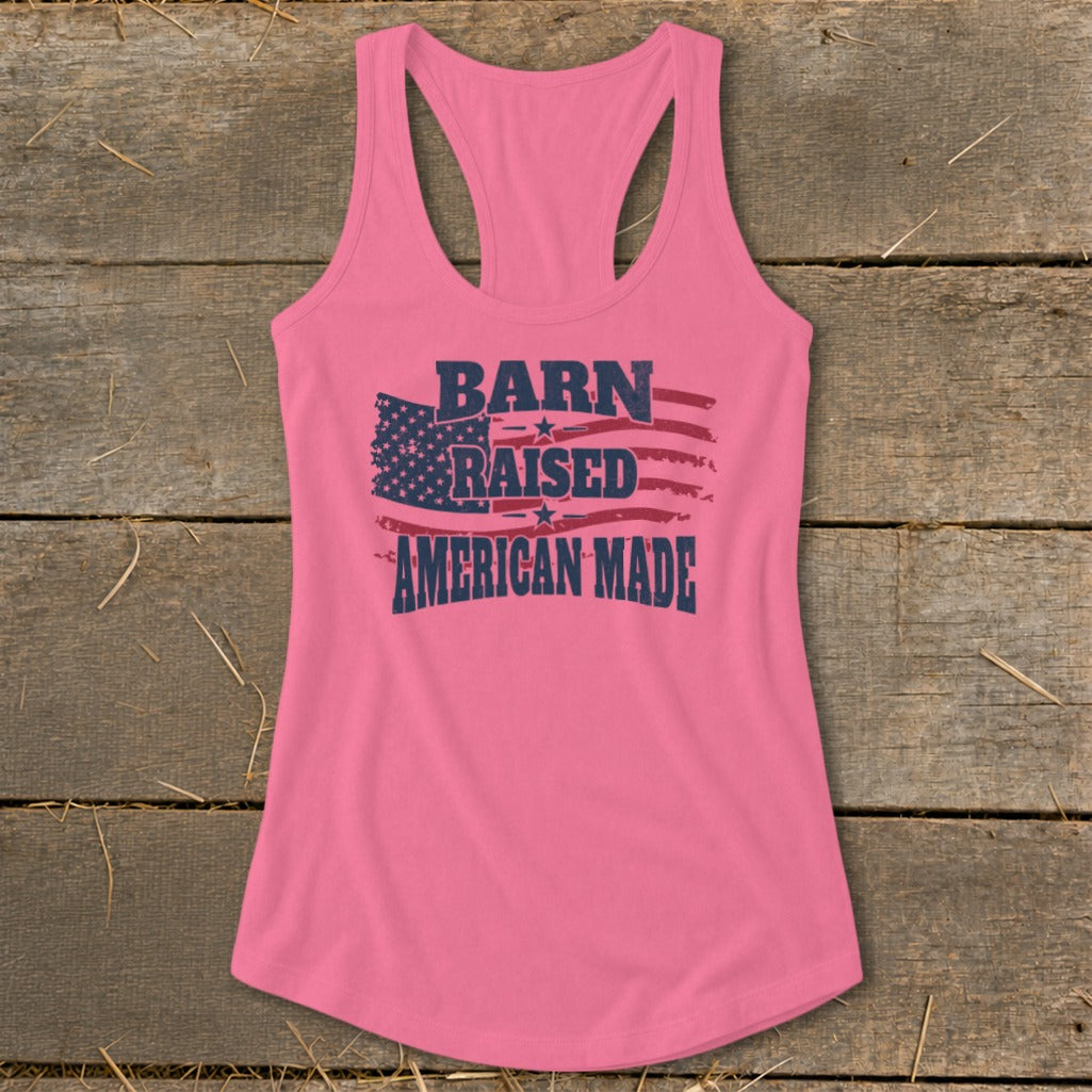Pink tank top with "BARN RAISED AMERICAN MADE" text over American flag graphic.