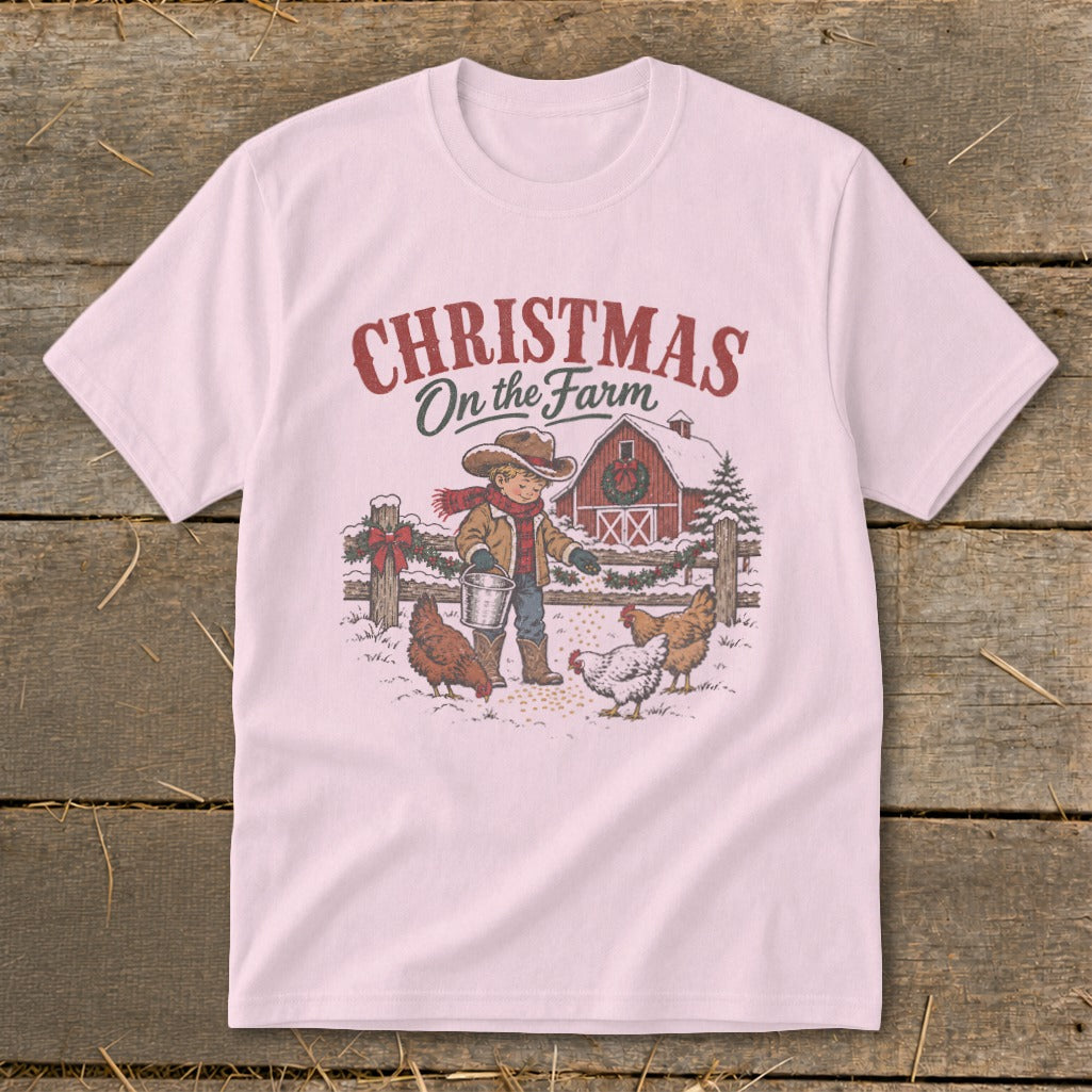 Pink t-shirt with "Christmas On the Farm" text and farm scene graphic.