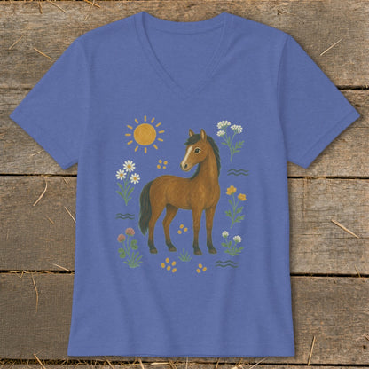 Brown horse with flowers, sun, and wavy lines on a purple t-shirt.