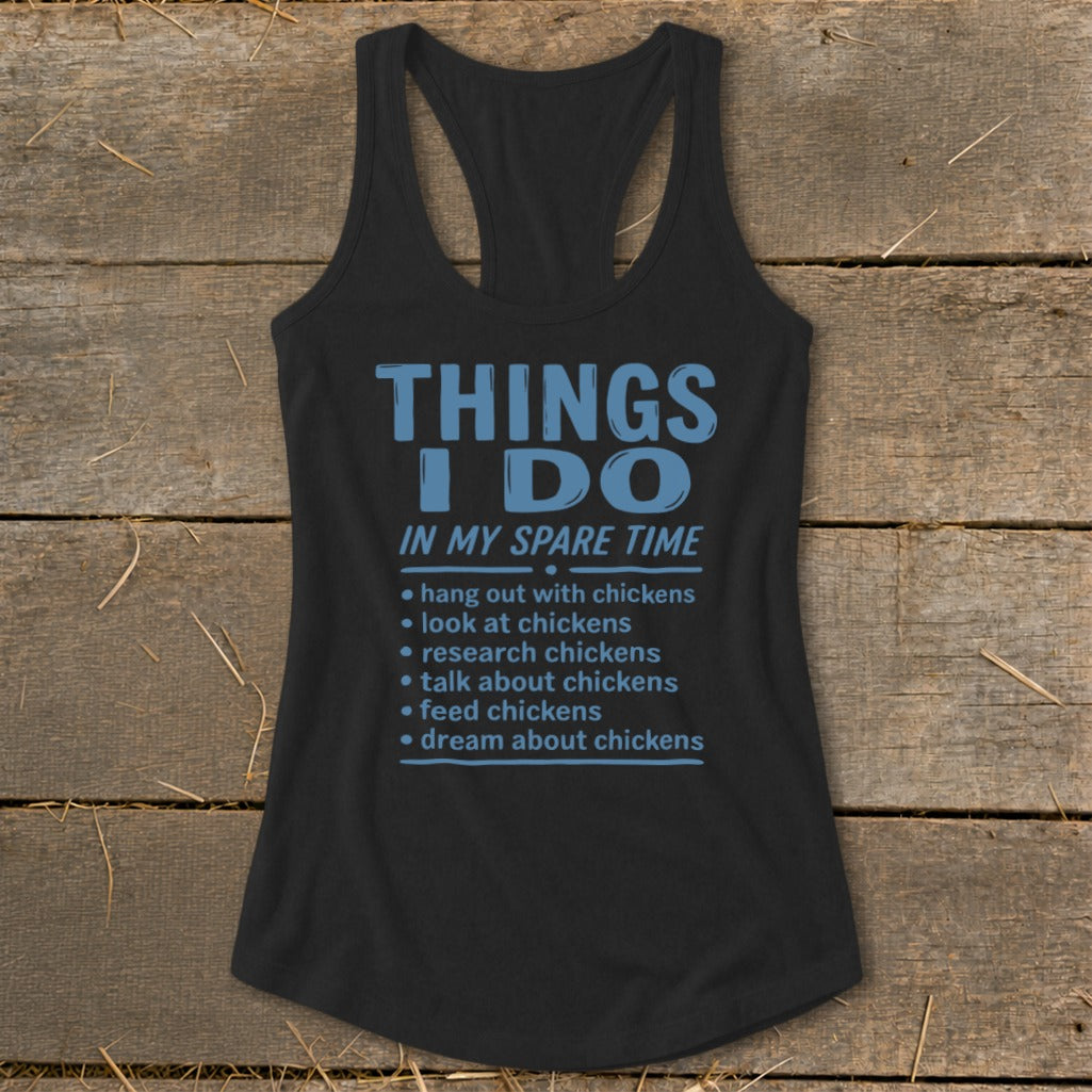 Black tank top with blue text listing chicken-related activities in spare time.