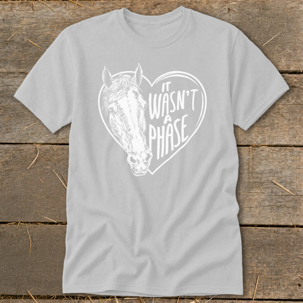 Light grey t-shirt with white horse head and text "IT WASN'T A PHASE" inside a heart.
